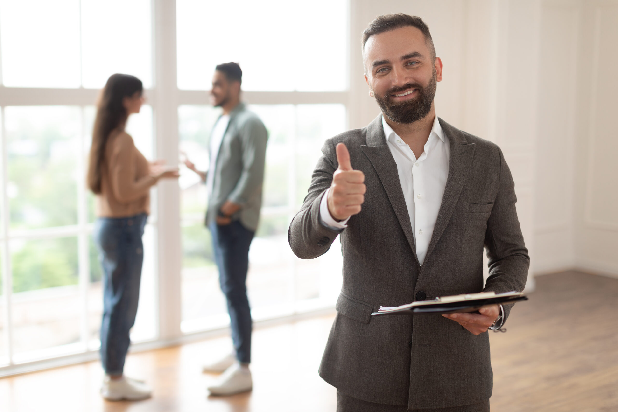 portrait of real estate agent showing thumbs up li 2023 11 27 04 53 33 utc scaled